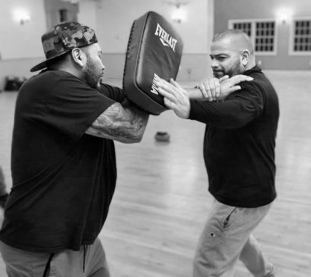Student pressing a kick shield